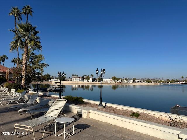 view of patio with a water view