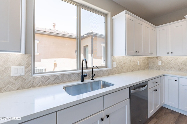 kitchen with sink, dark wood-type flooring, white cabinetry, and dishwasher