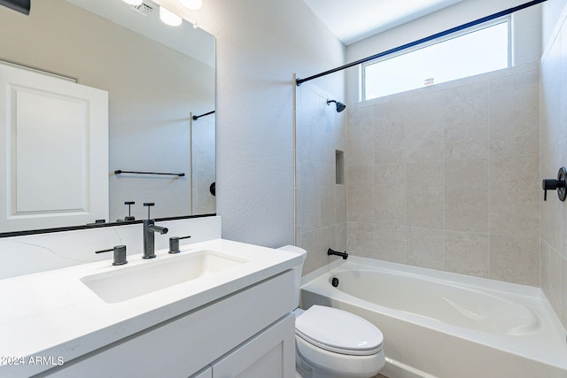 full bathroom featuring toilet, vanity, and shower / bathtub combination