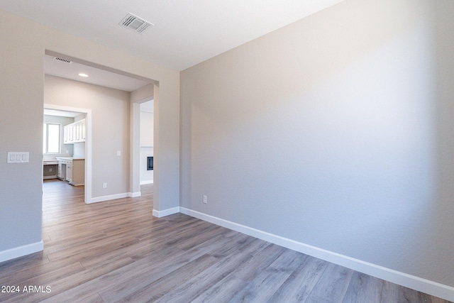 unfurnished room featuring light hardwood / wood-style floors