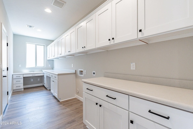 kitchen featuring white cabinets and light hardwood / wood-style floors