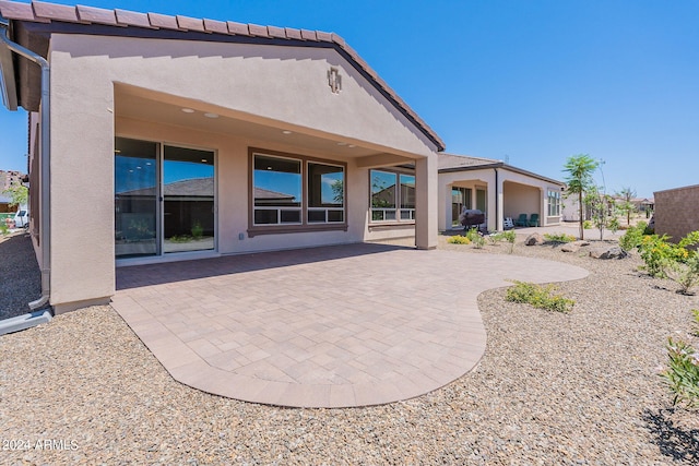 rear view of house with a patio area