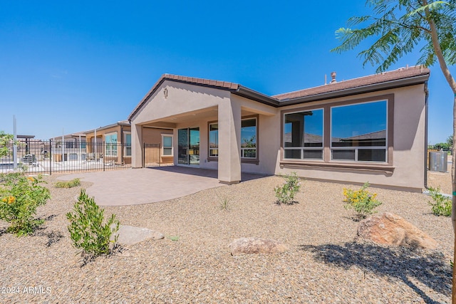 back of property featuring a patio