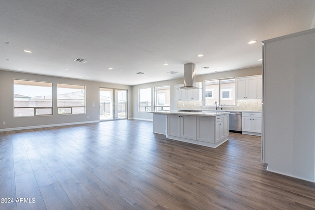 kitchen featuring dishwasher, island range hood, decorative backsplash, a kitchen island, and white cabinets