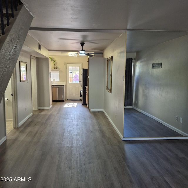 2946 N 14th St N Unit 14, Phoenix, AZ 85014 - unfurnished living room featuring a ceiling fan and dark wood-style flooring