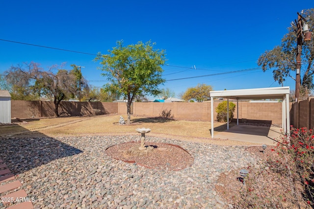 view of yard with a patio area and a fenced backyard