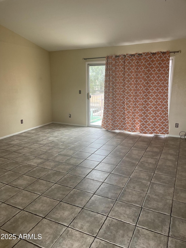 653 W Guadalupe Rd Unit 2019, Mesa, AZ 85210 - unfurnished room featuring tile patterned floors and baseboards
