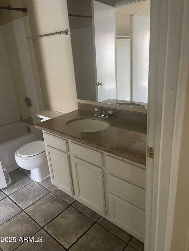 653 W Guadalupe Rd Unit 2019, Mesa, AZ 85210 - bathroom with toilet, tile patterned floors, vanity, and  shower combination