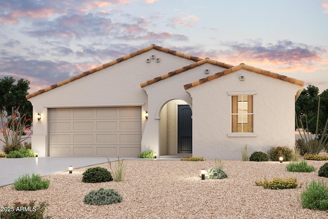 39985 W Sparks Ln, Maricopa, AZ 85138 - mediterranean / spanish-style house with concrete driveway, an attached garage, stucco siding, and a tile roof