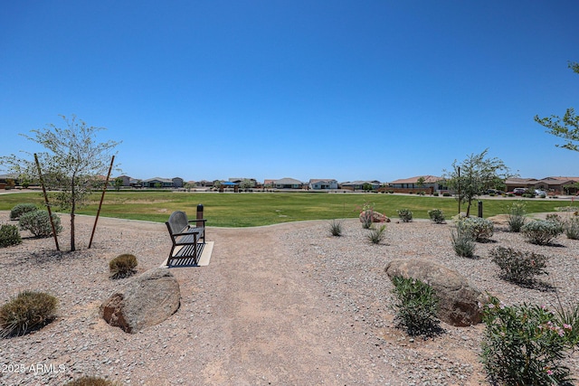 39985 W Sparks Ln, Maricopa, AZ 85138 - view of community with a lawn and a residential view