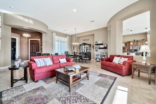 living room with a notable chandelier