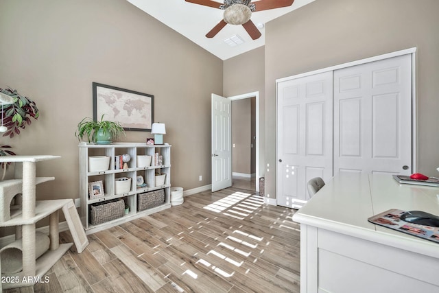 office area featuring lofted ceiling and ceiling fan