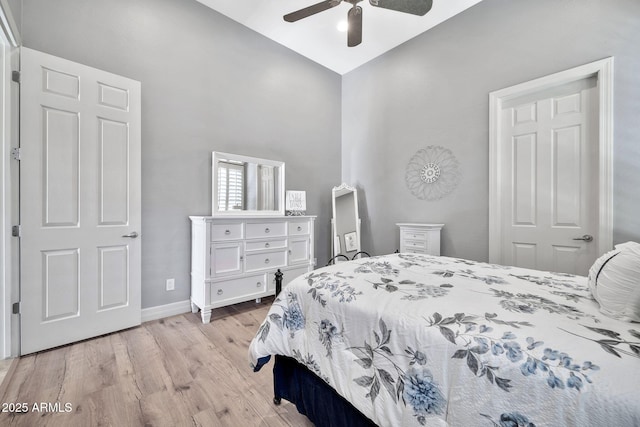 bedroom with light wood-type flooring, ceiling fan, and lofted ceiling