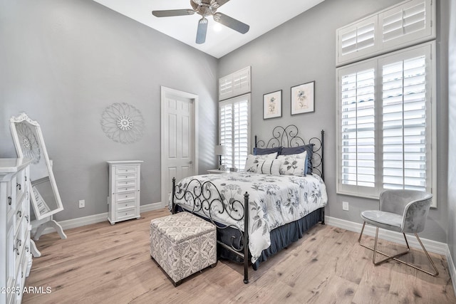 bedroom with ceiling fan and light hardwood / wood-style flooring