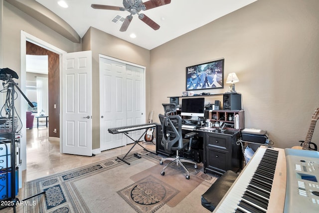 tiled office space featuring ceiling fan