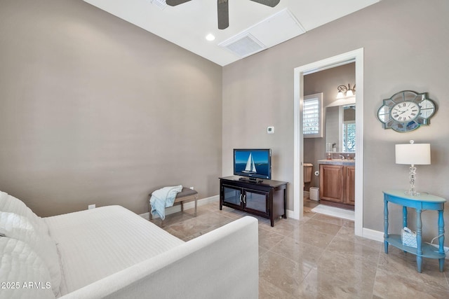 bedroom featuring ceiling fan and ensuite bath