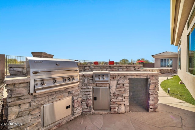 view of patio featuring grilling area and exterior kitchen