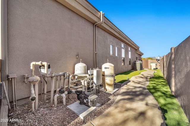 view of property exterior with central AC