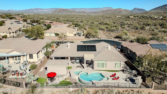 birds eye view of property with a mountain view