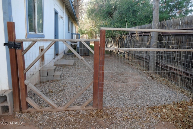 view of gate featuring fence