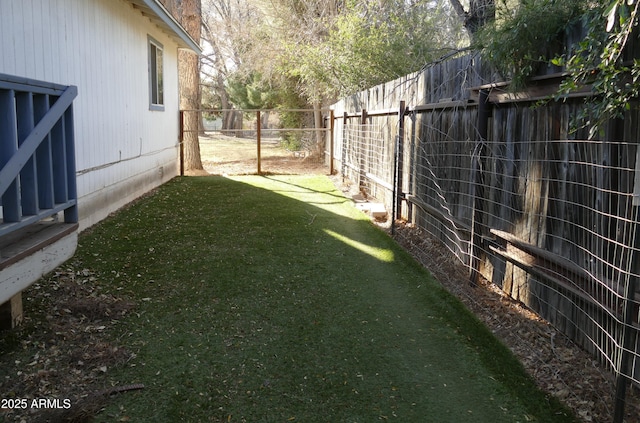 view of yard featuring a fenced backyard