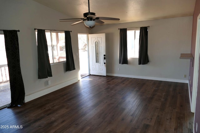 entrance foyer with lofted ceiling, dark wood-style floors, and a wealth of natural light