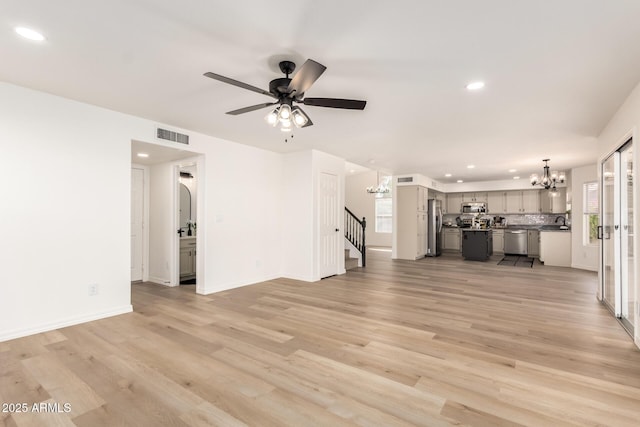 1202 E Libby St, Phoenix, AZ 85022 - unfurnished living room featuring a chandelier, stairs, recessed lighting, ceiling fan, and plenty of natural light