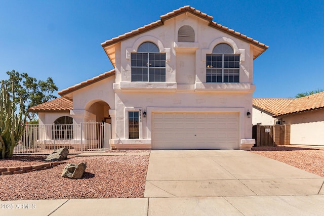 1202 E Libby St, Phoenix, AZ 85022 - mediterranean / spanish home featuring a tile roof, stucco siding, and an attached garage