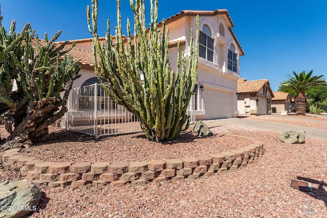 1202 E Libby St, Phoenix, AZ 85022 - view of front of property featuring a tile roof, an attached garage, and stucco siding