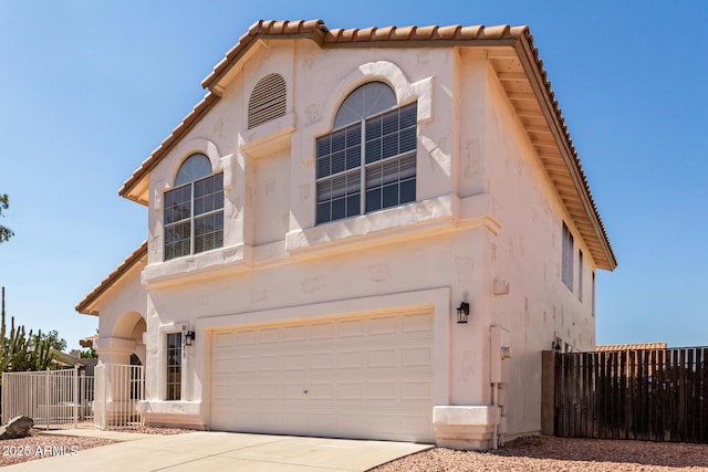 1202 E Libby St, Phoenix, AZ 85022 - view of front of property with an attached garage, a tile roof, and stucco siding