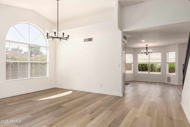 1202 E Libby St, Phoenix, AZ 85022 - unfurnished dining area with a chandelier, light wood-type flooring, and baseboards
