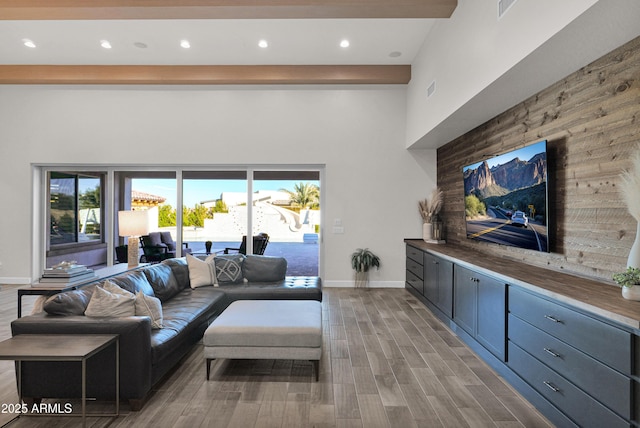 living room featuring beam ceiling