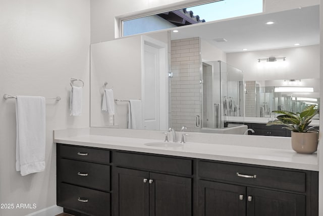 bathroom with vanity and an enclosed shower