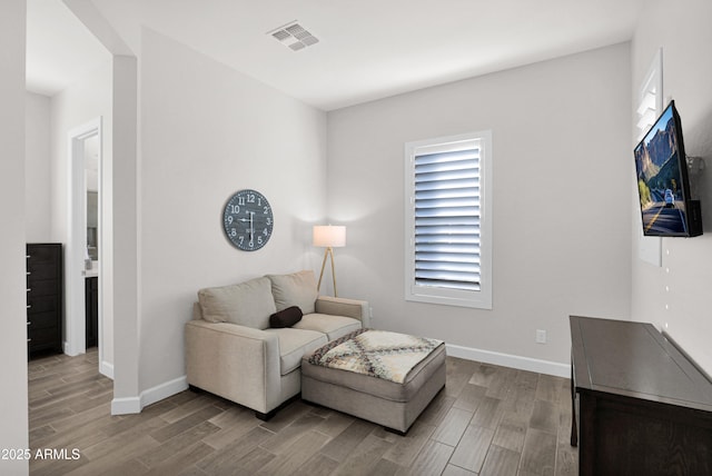 sitting room featuring light hardwood / wood-style flooring