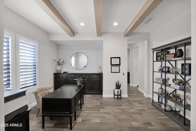 dining area with beam ceiling and plenty of natural light