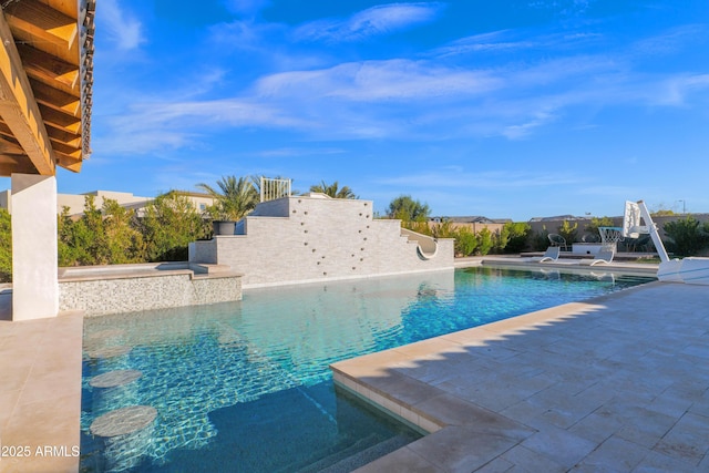 view of swimming pool featuring a patio area