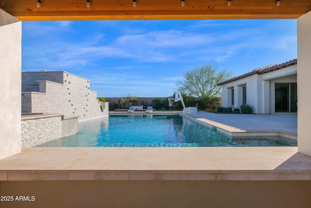 view of pool featuring a patio area