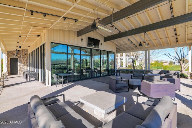 view of patio / terrace featuring ceiling fan and an outdoor hangout area