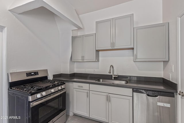 430 N 17th Ave, Phoenix, AZ 85007 - kitchen featuring appliances with stainless steel finishes, dark countertops, and gray cabinets