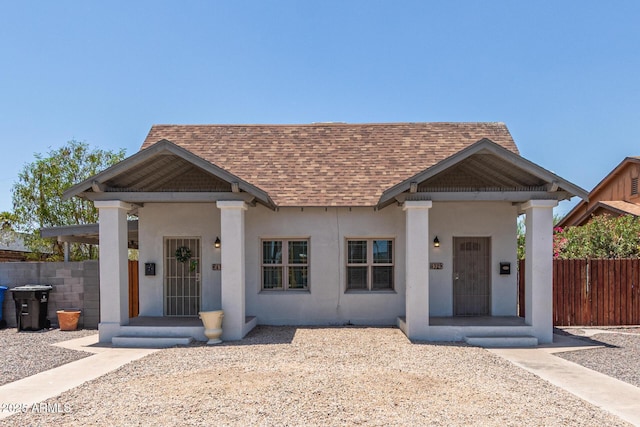 430 N 17th Ave, Phoenix, AZ 85007 - view of front facade with roof with shingles, a porch, and stucco siding
