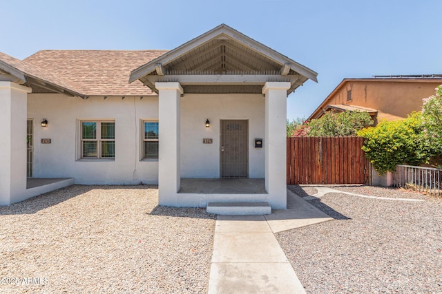430 N 17th Ave, Phoenix, AZ 85007 - entrance to property featuring roof with shingles and stucco siding