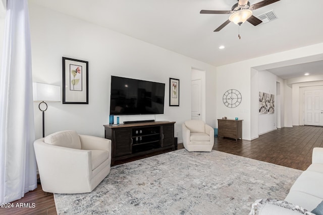 living area featuring recessed lighting, visible vents, dark wood finished floors, and a ceiling fan