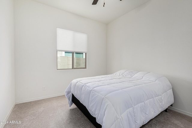 bedroom with a ceiling fan, carpet, and baseboards