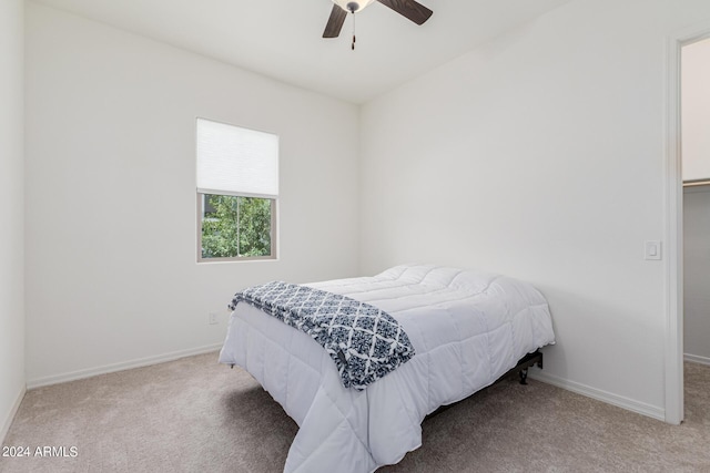 bedroom with carpet flooring, ceiling fan, and baseboards