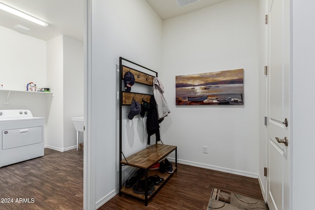 interior space featuring dark wood finished floors, washer / clothes dryer, and baseboards