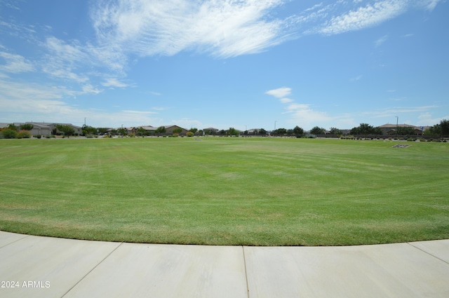 surrounding community featuring a lawn