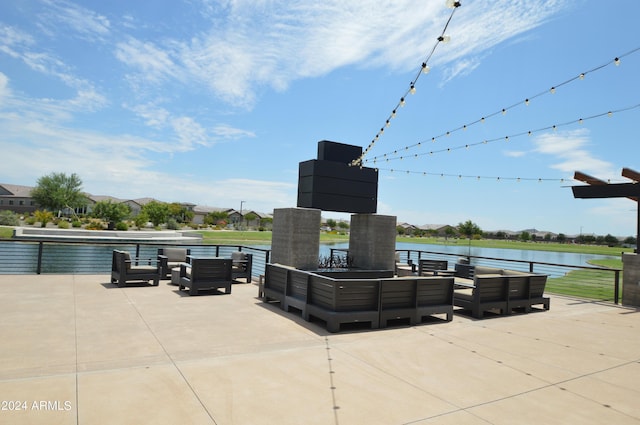 view of patio / terrace with an outdoor hangout area and a water view