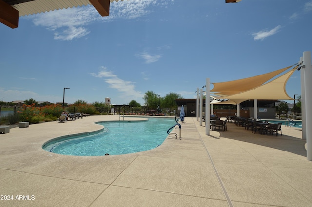 pool with a patio area