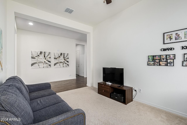 carpeted living room featuring visible vents, recessed lighting, and baseboards