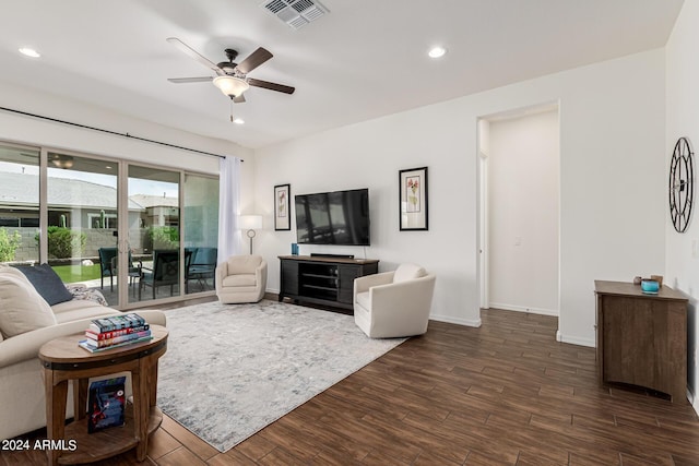 living area with dark wood-style floors, visible vents, recessed lighting, and ceiling fan